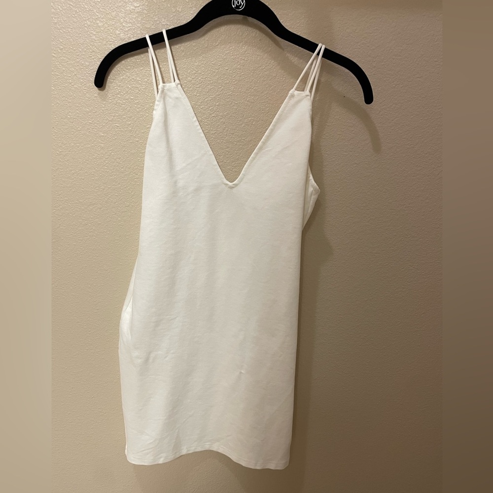 Small, white, by the way brand mini dress with double straps. Worn once!